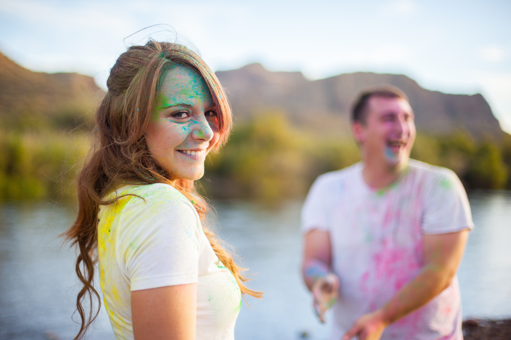 post color fight picture of couple with colored powder all over
