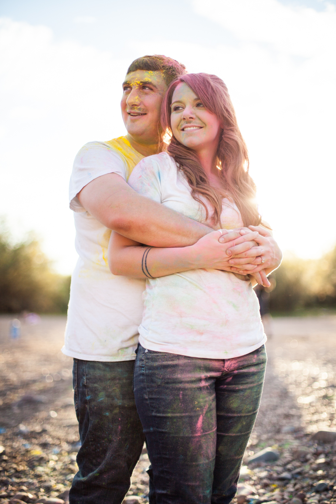post color fight engaged couple holding eachother
