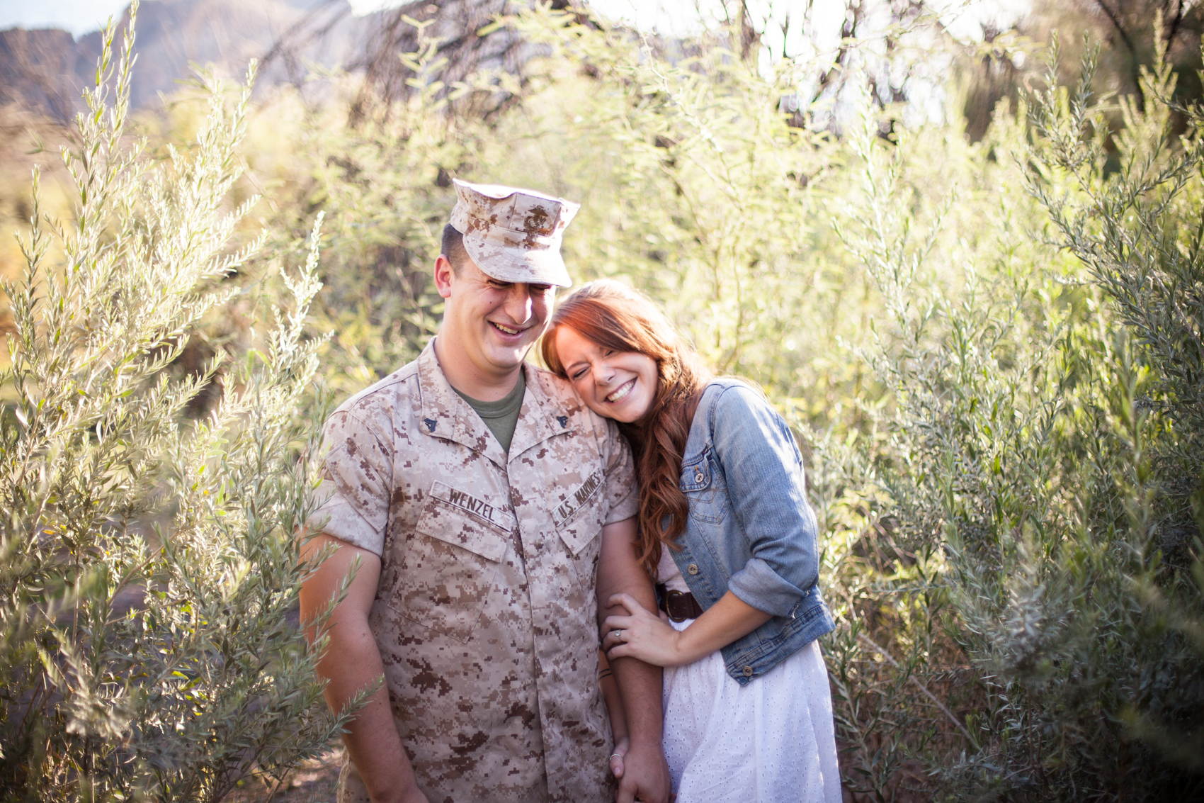 Laughing Military couple in desert foliage