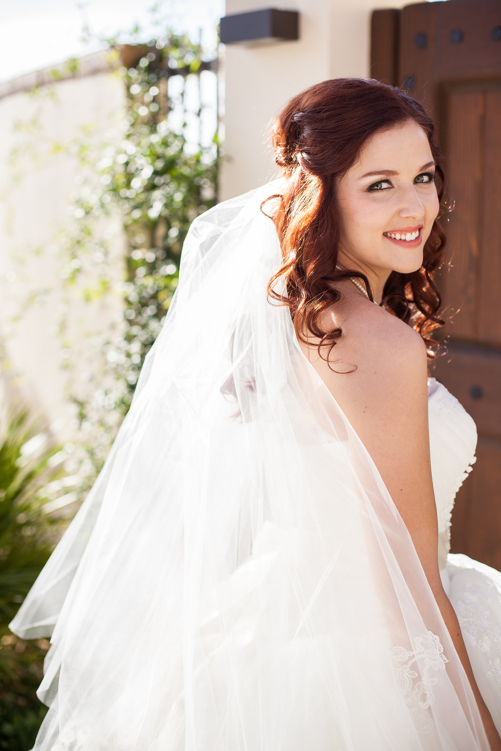 bride on wedding day with tulle veil