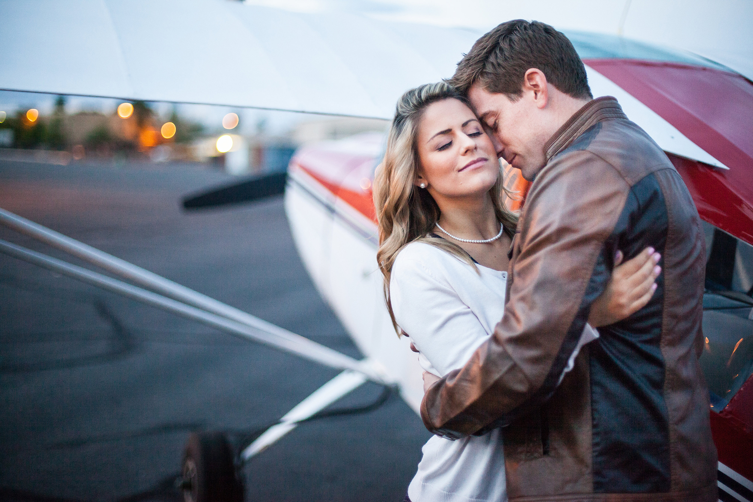 vintage styled couple with vintage airplane