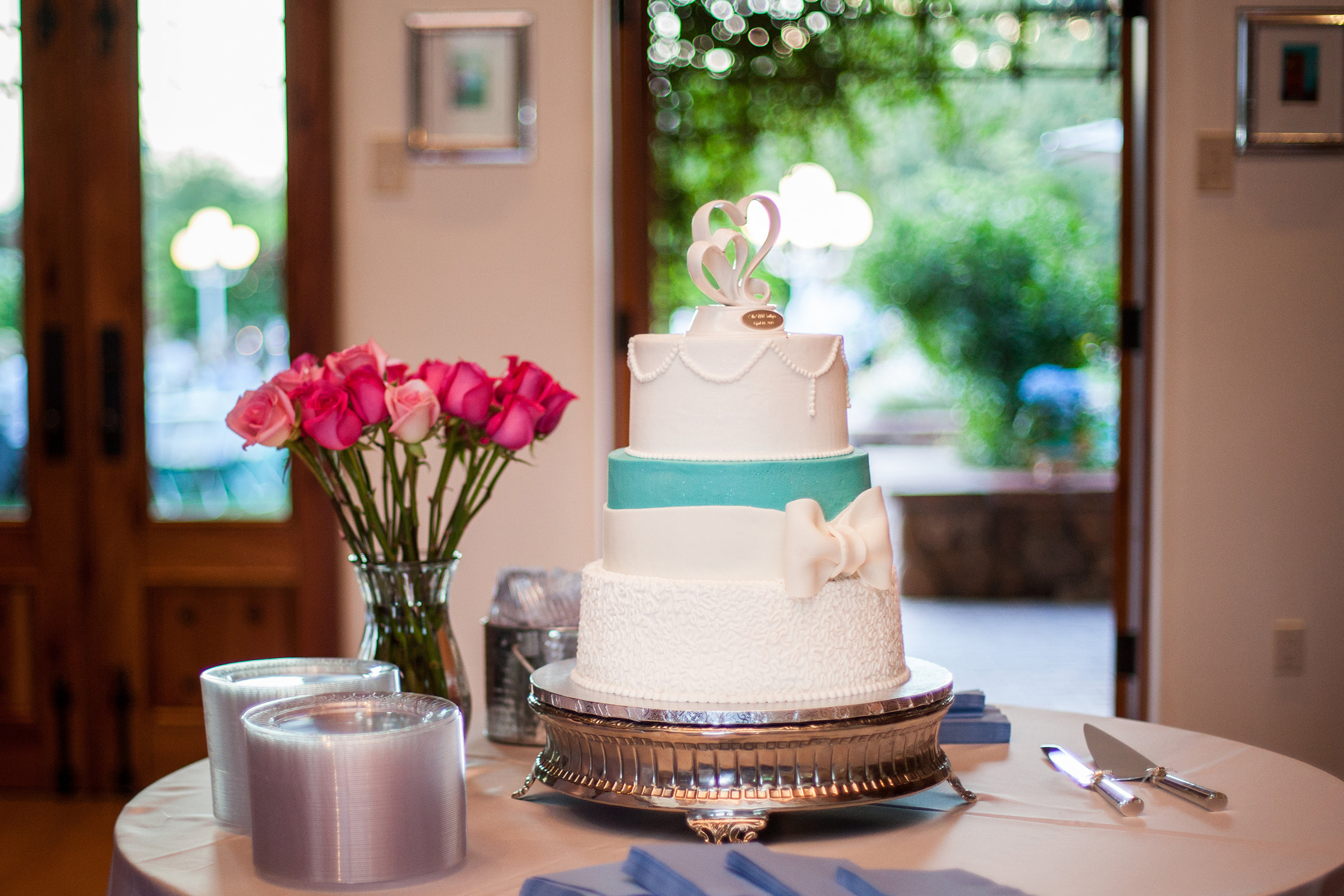 white and turquoise 3 tier wedding cake