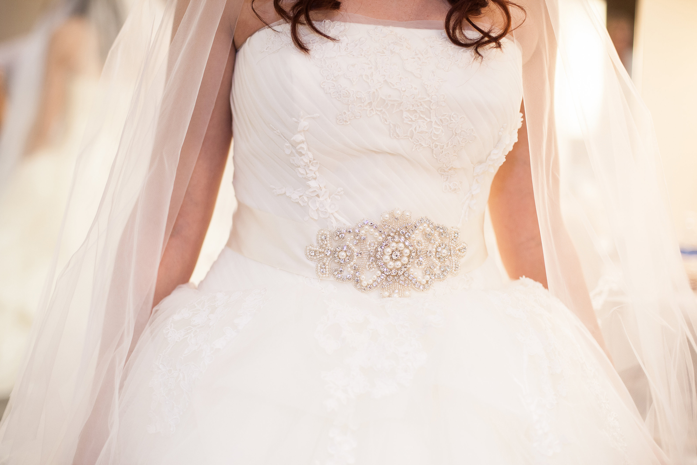 ballgown wedding dress with ornate sash belt