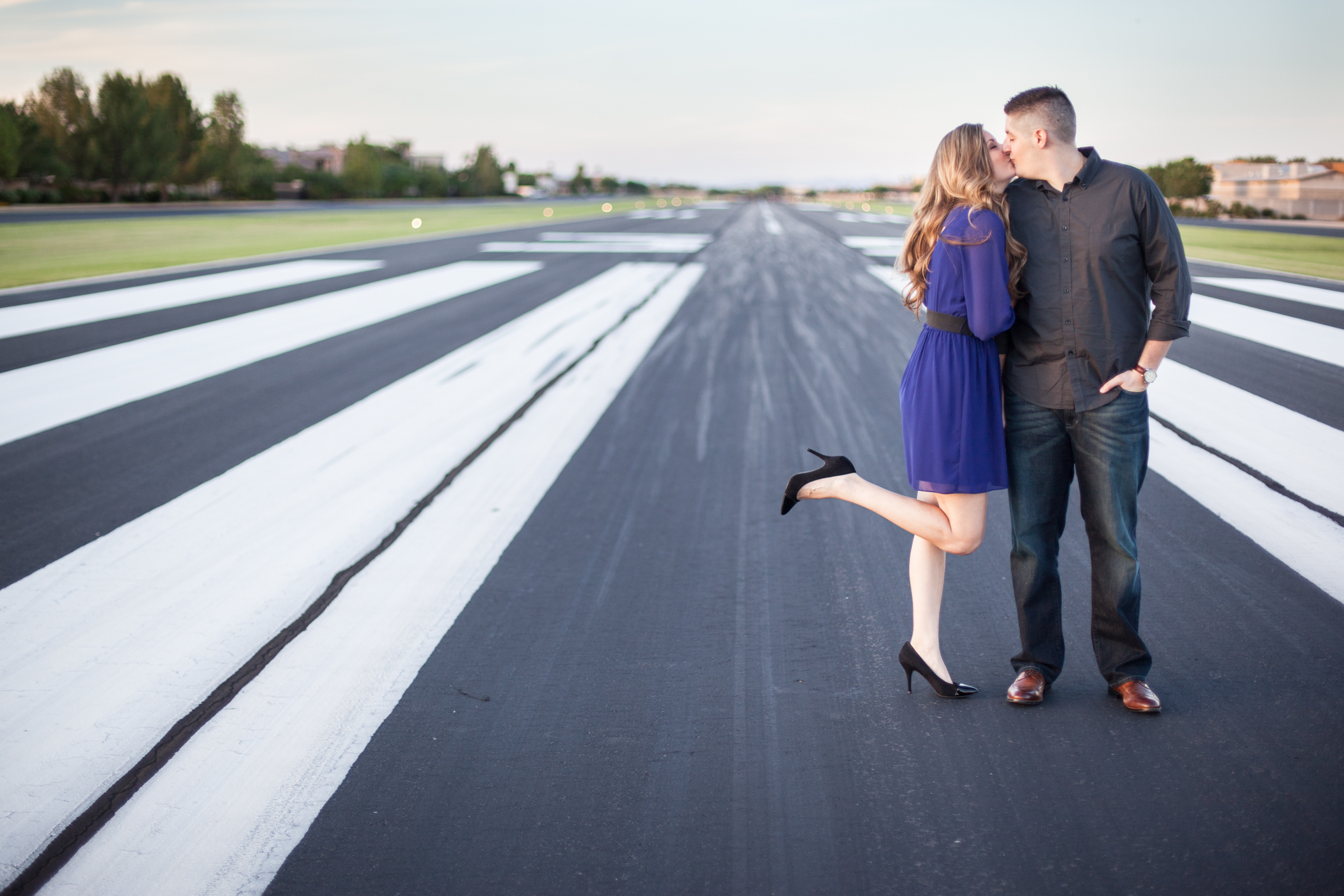 airport engagement pictures on tarmac