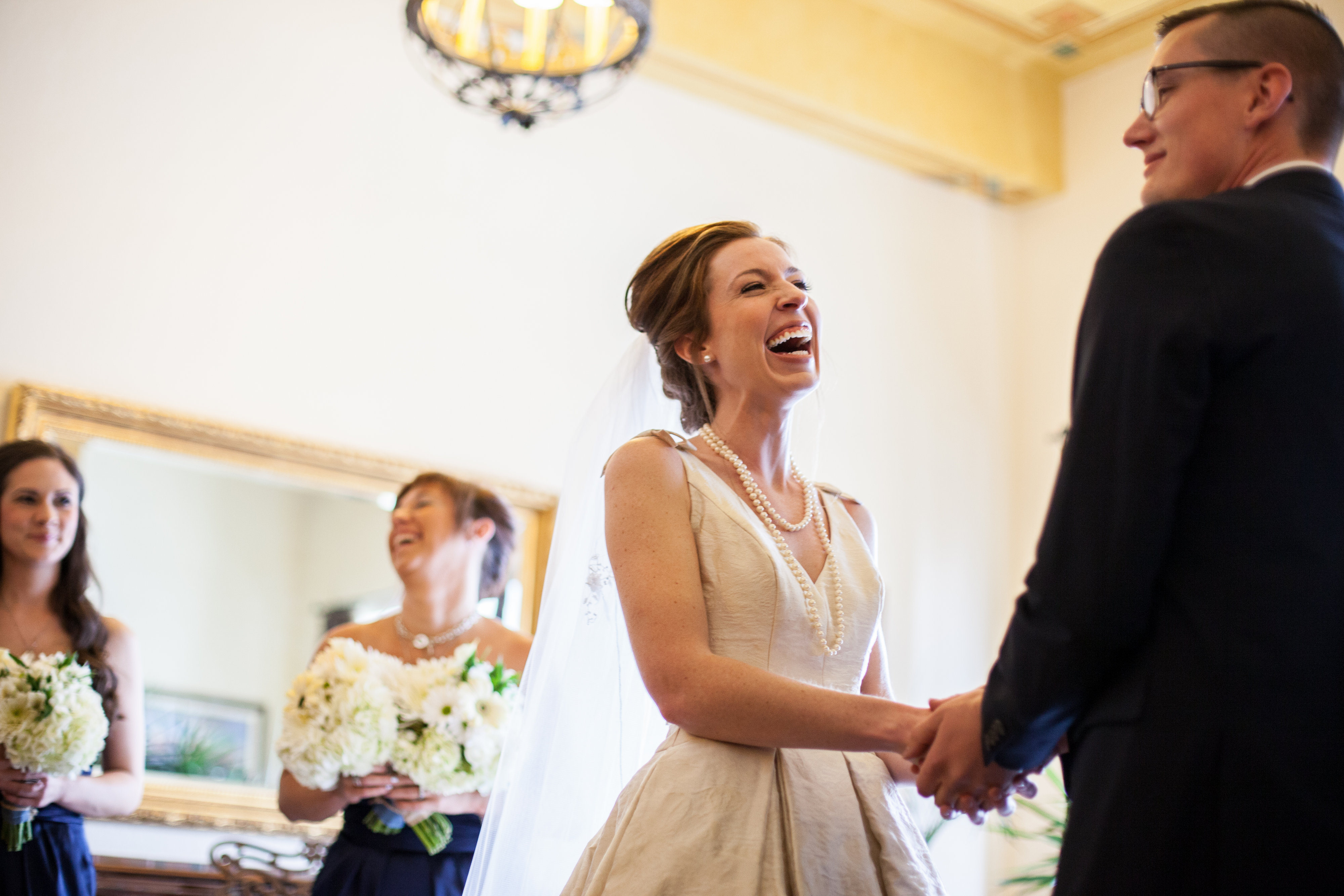 bride laughing at ceremony