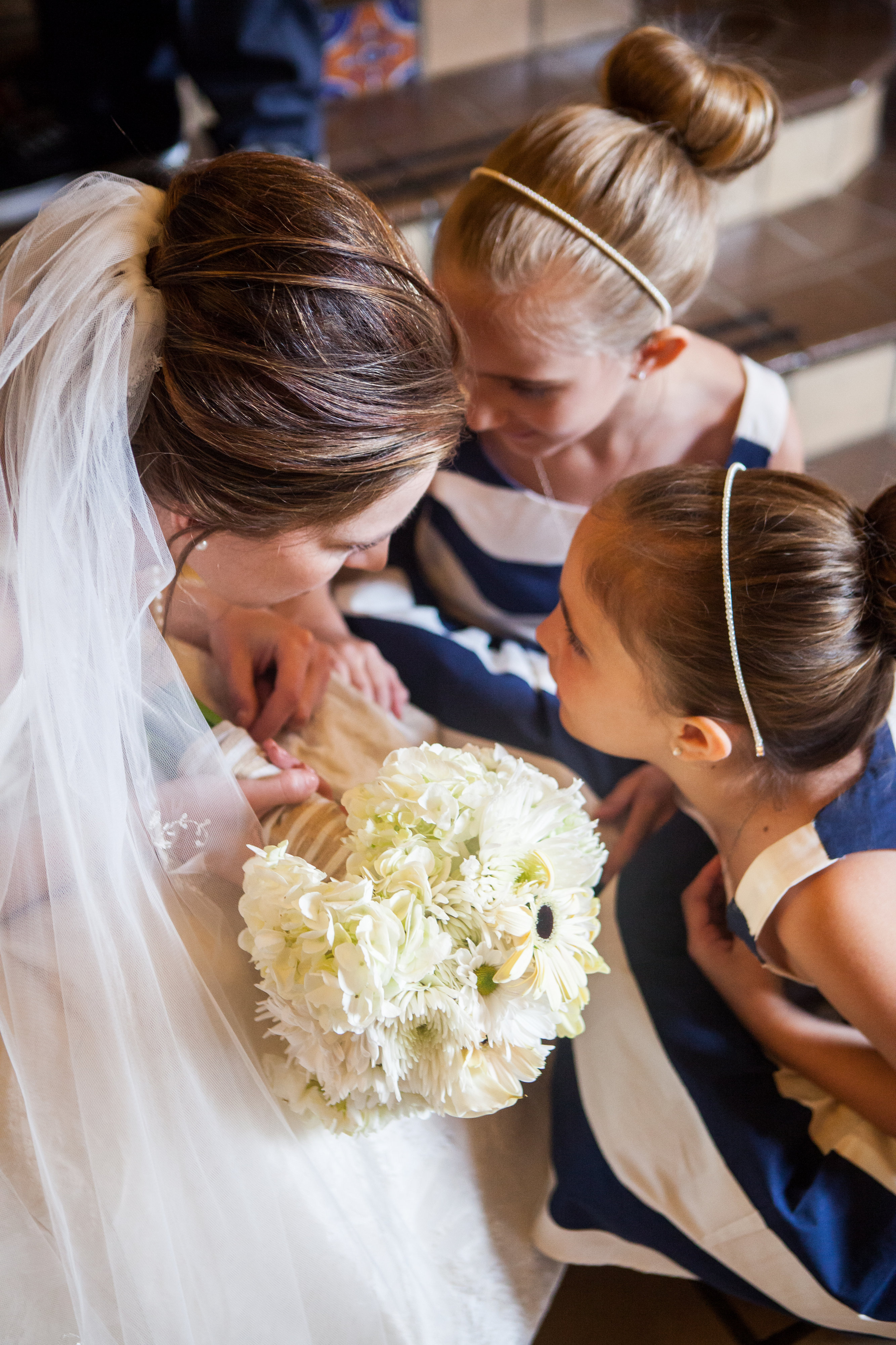 bride and flower girls with white bridal bouquet