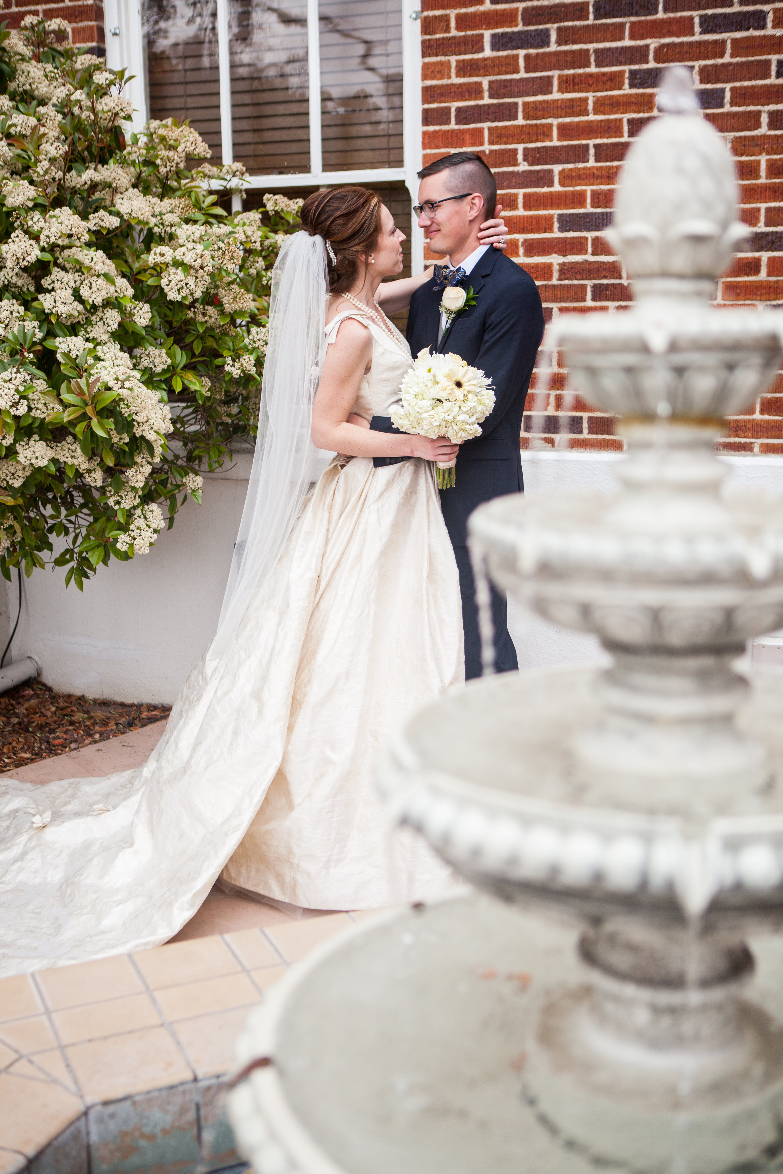 bride and groom with a fountain