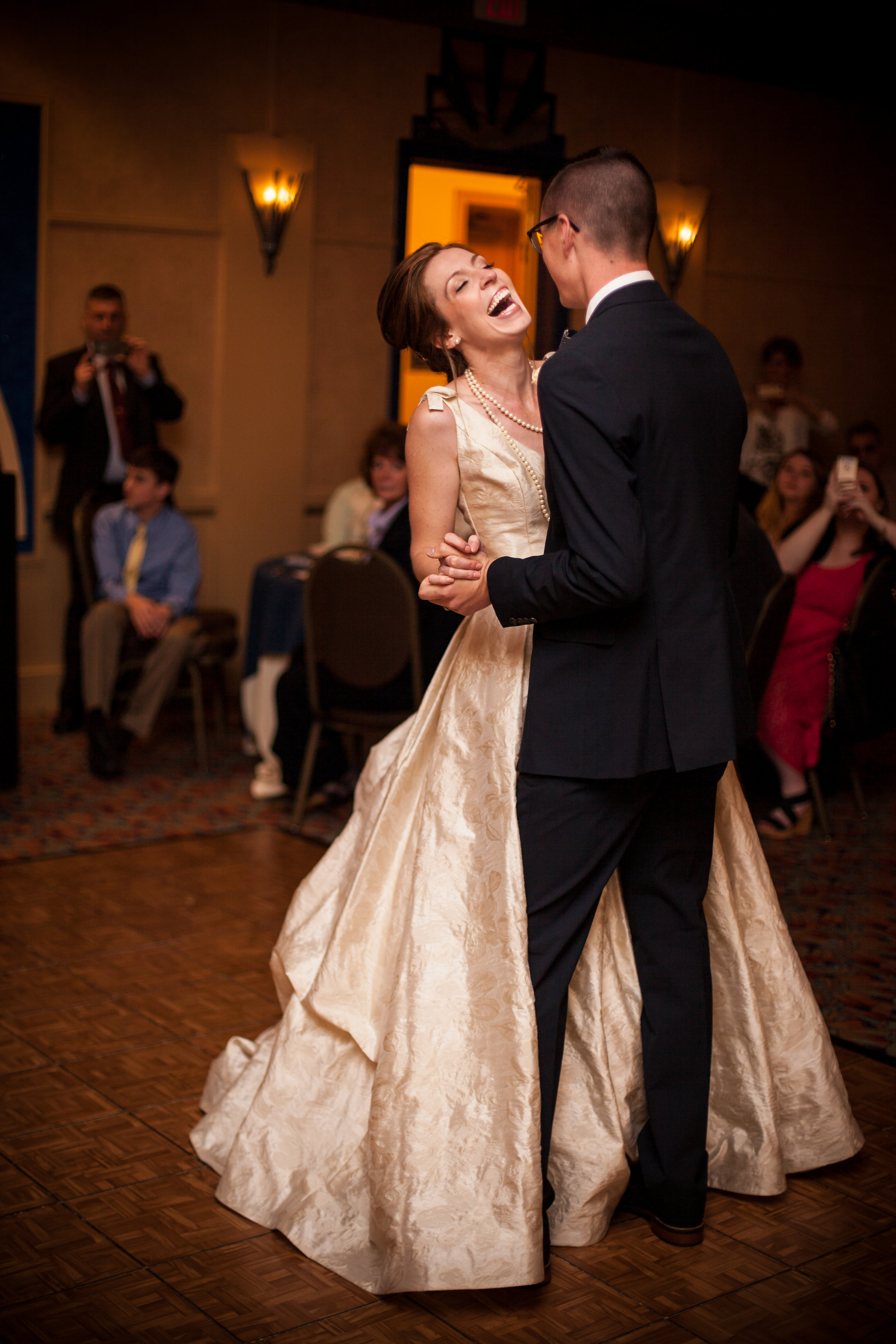 bride and groom laughing during first dance