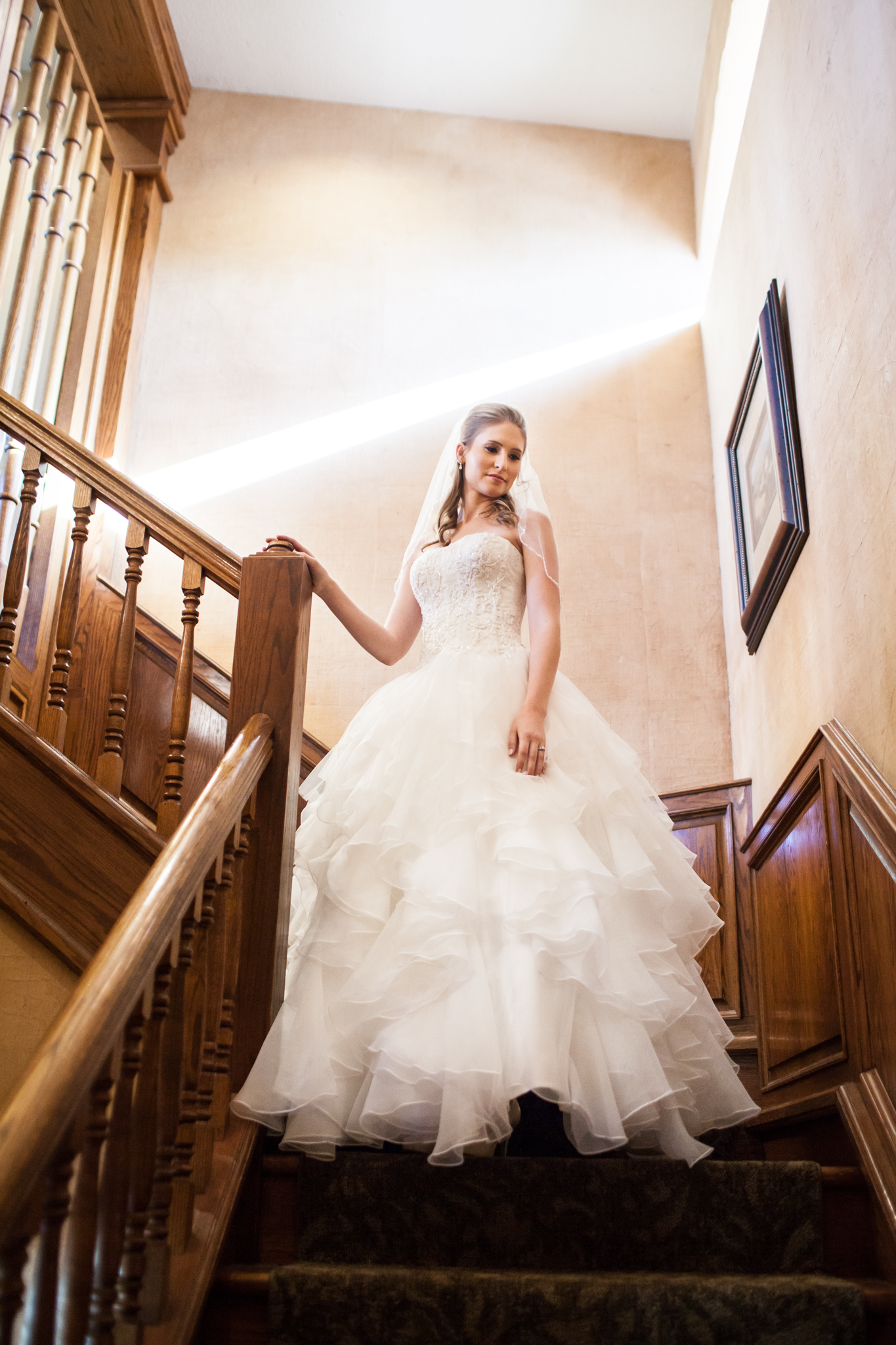 bride on sunlit staircase