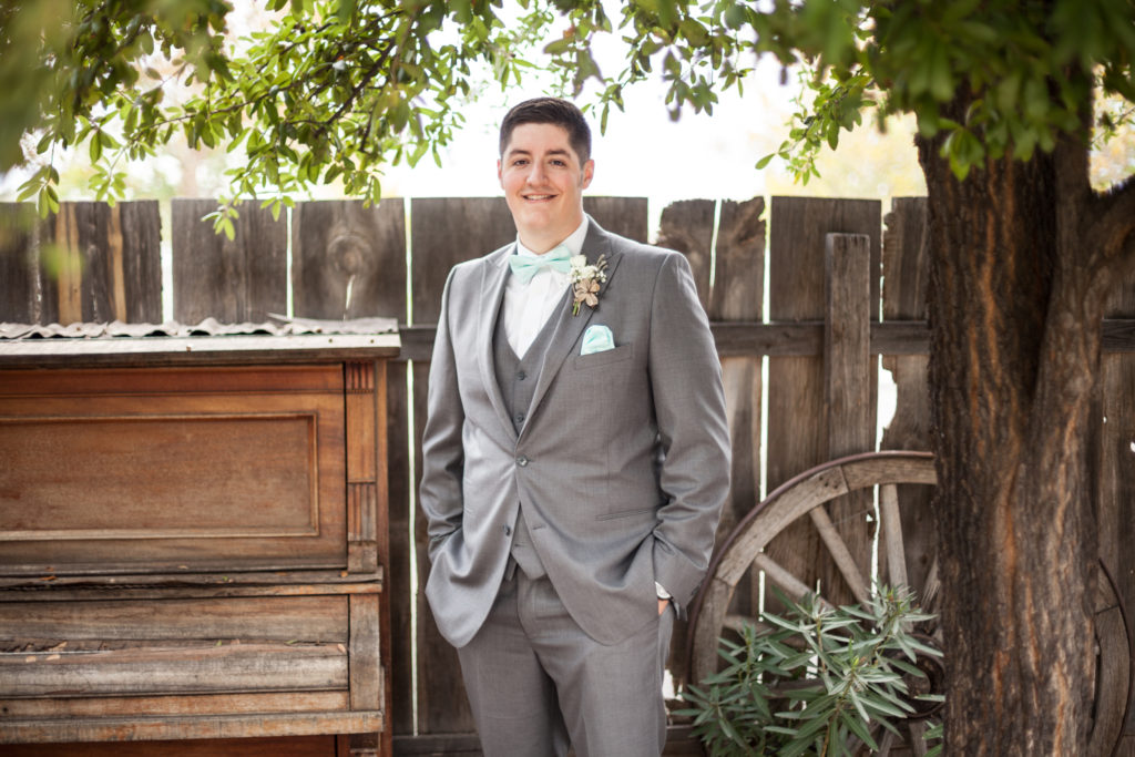 groom with grey suit and tiffany blue bowtie and pocket square