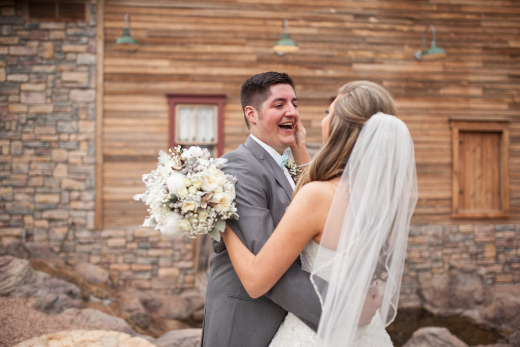 bride and groom first look with rustic cotton bouquet