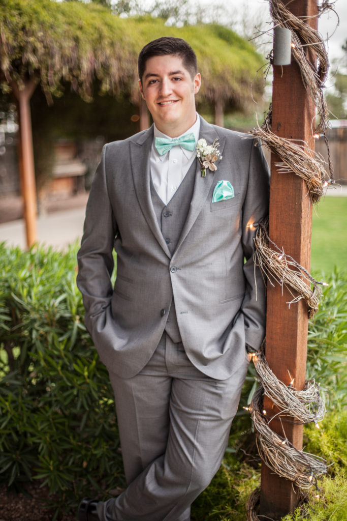 groom with grey suit and tiffany blue bowtie