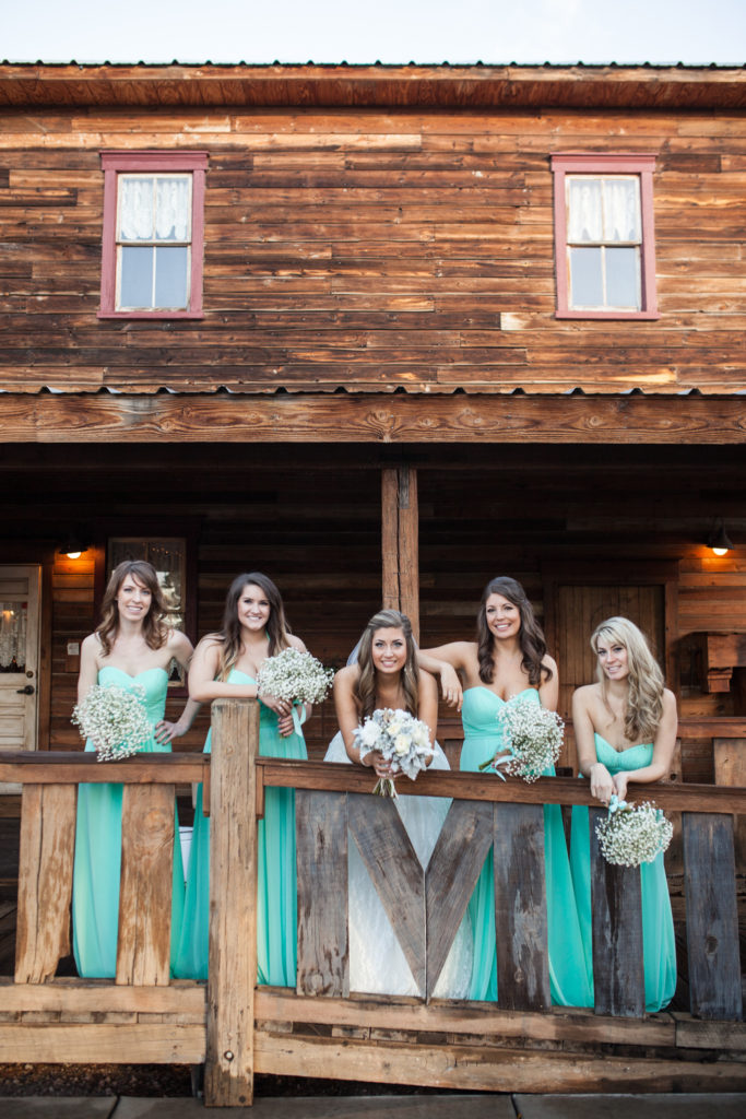 fun bridesmaids pose with tiffany blue bridesmaid dresses