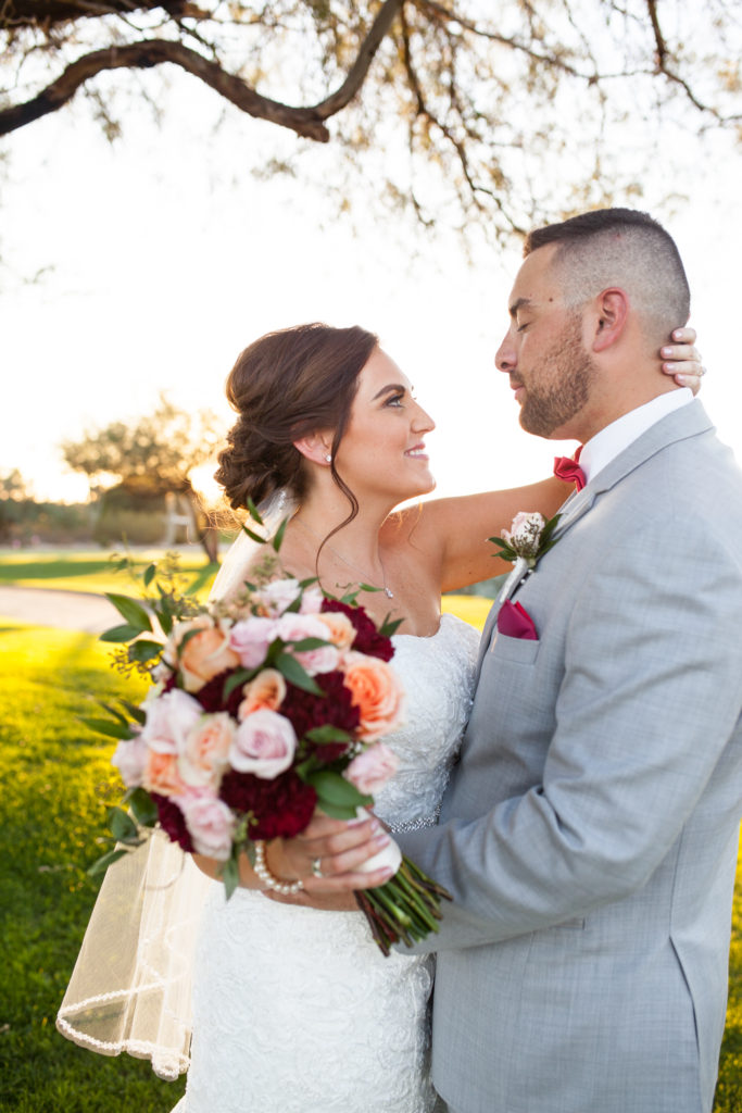 bride and groom with fall wedding bouquet
