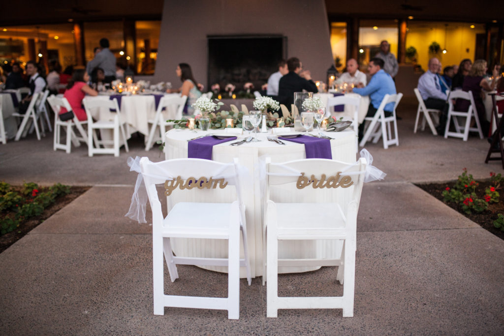 wedding sweetheart table ideas. Bride and groom seat signs.