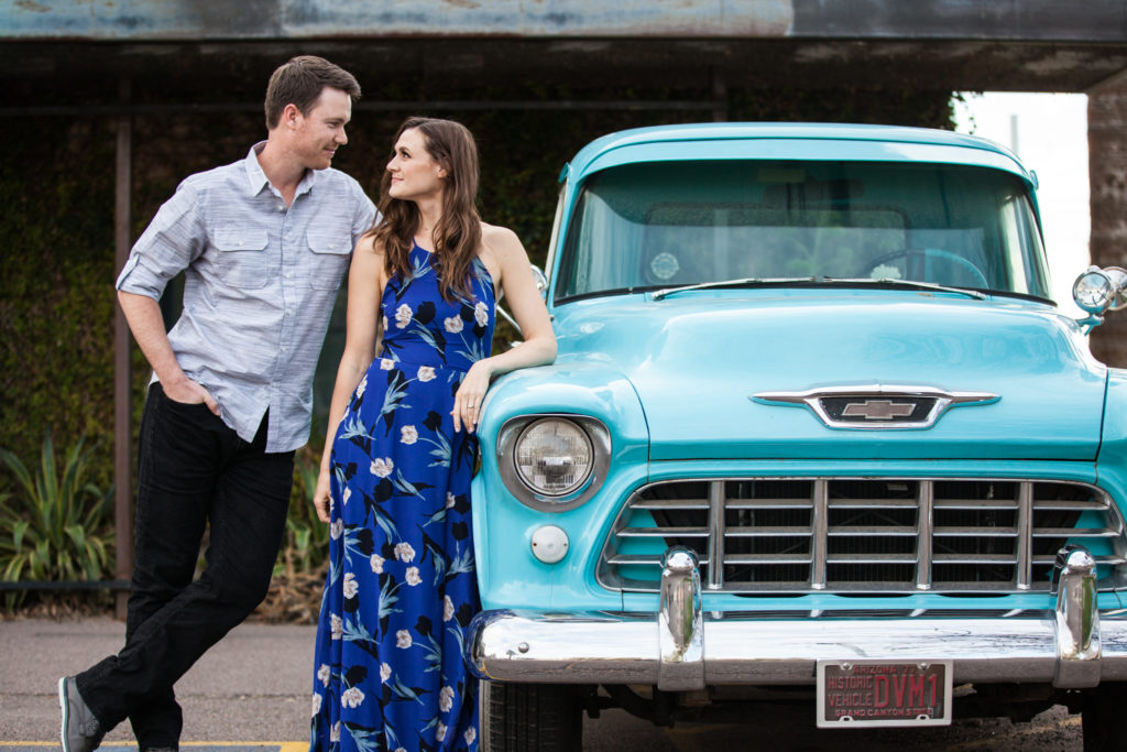 downtown phoenix engagement photos engagement pictures engagement photographer vintage blue truck old ford truck tiffany blue engagement picture with old car long flowy blue dress from lulus