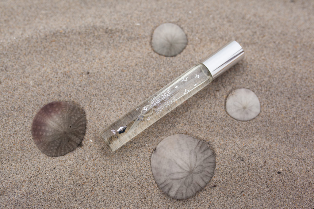 anthropologie perfume in sand with sand dollars she knew he was forever