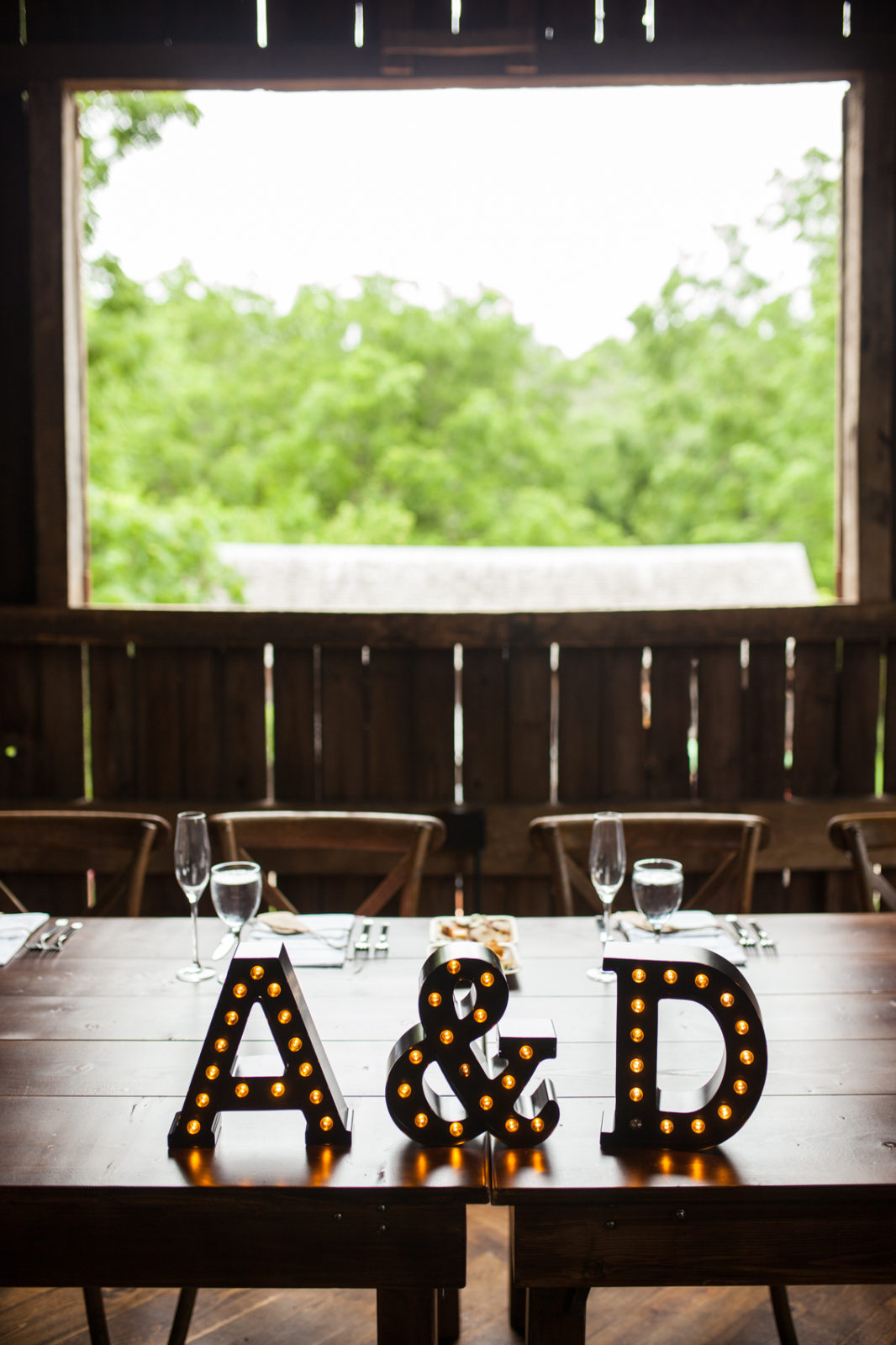 wedding reception in the barn of The Farm at Dover head table with marquee letters