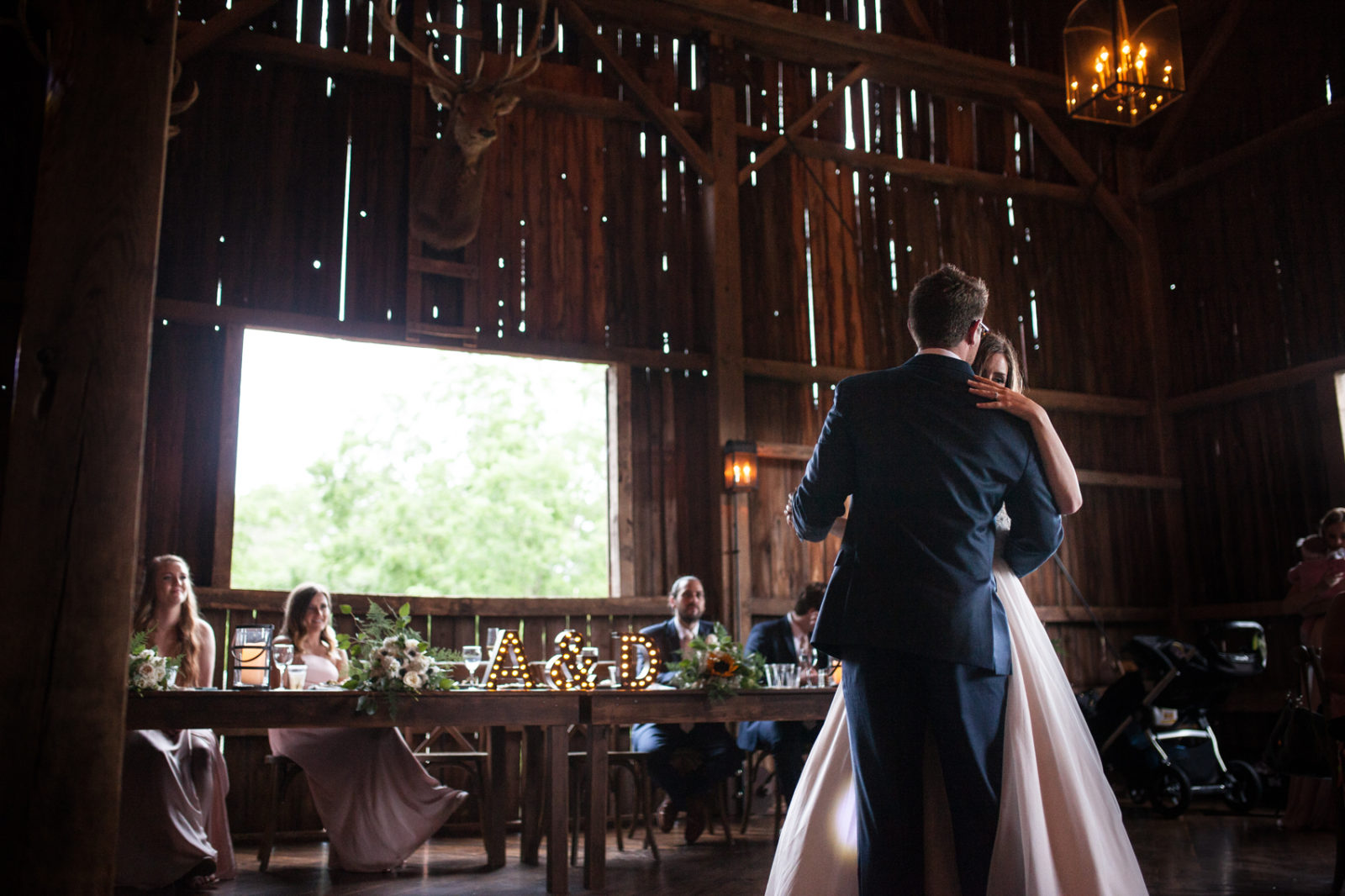 first dance during wedding reception in the barn of The Farm at Dover