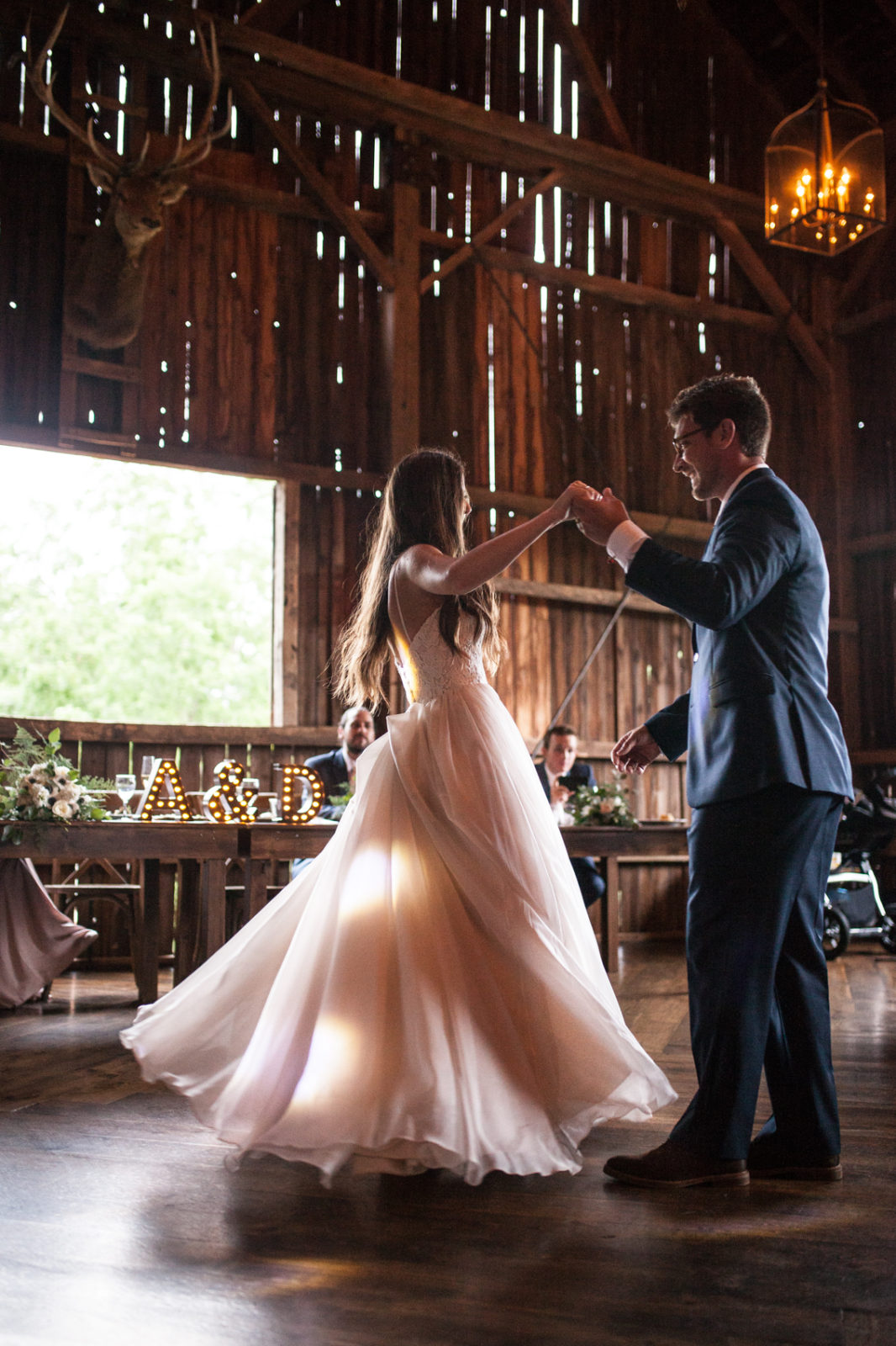 first dance during wedding reception in the barn of The Farm at Dover