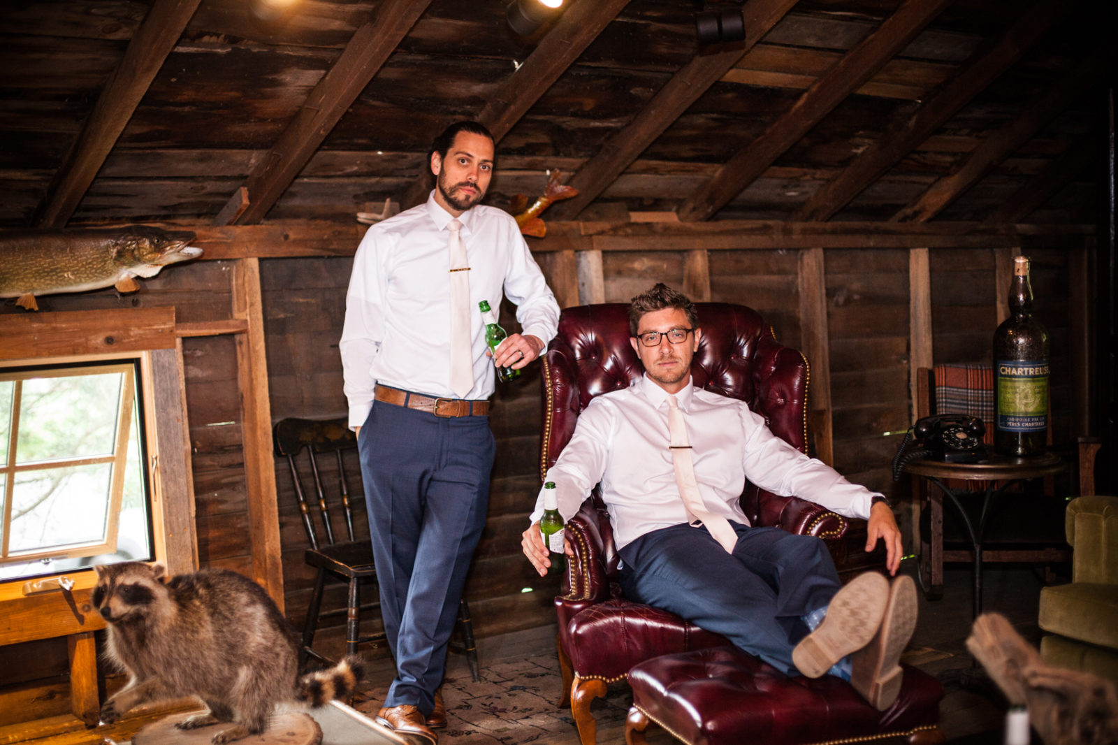 groom and groomsmen in the mens cabin at the farm at dover