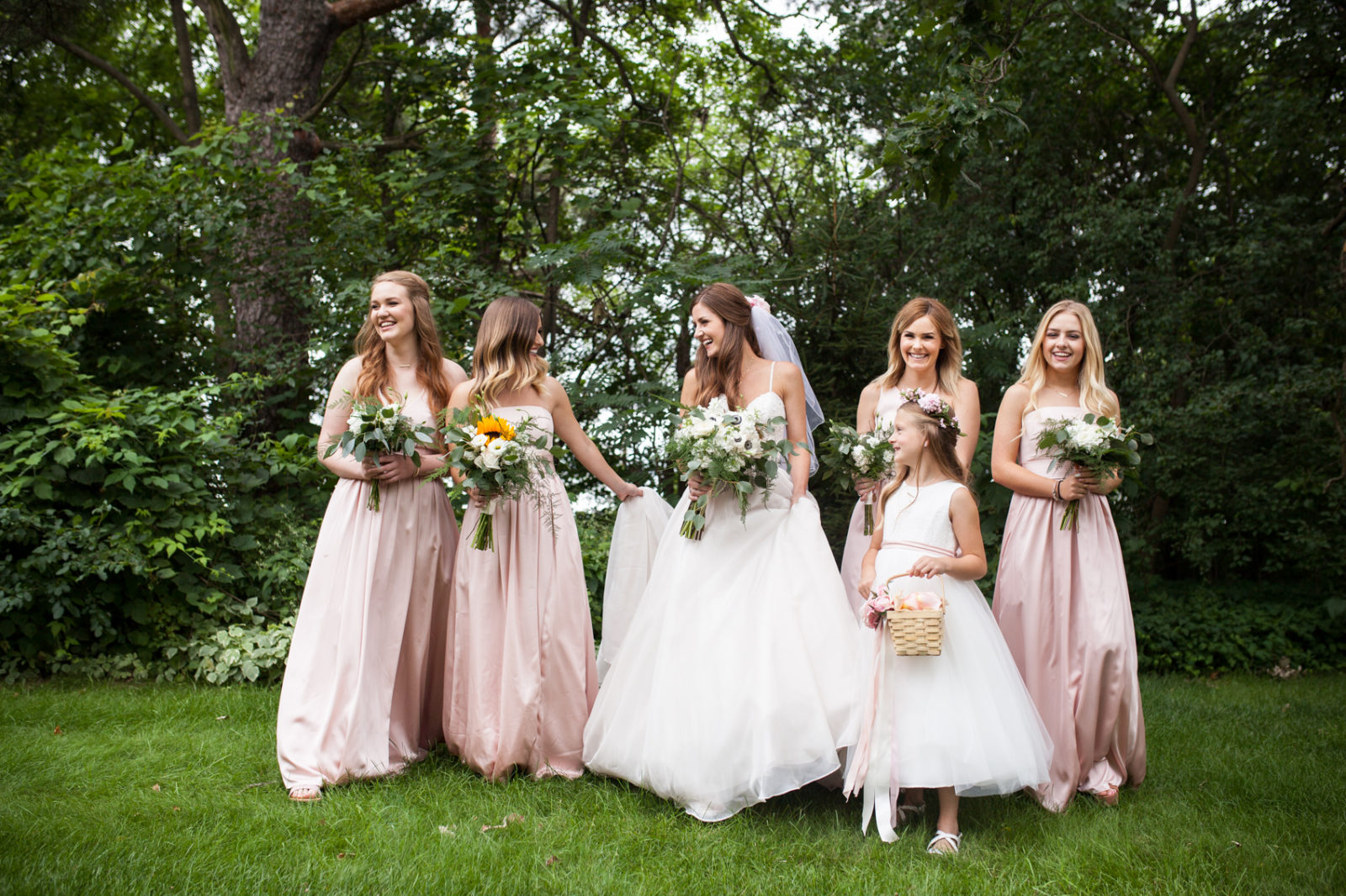 bridesmaids and bride, essence of australia wedding dress from Uptown Bridal at the farm at dover milwaukee with florals by Gia Bella Flowers makeup by Blush by Brittany