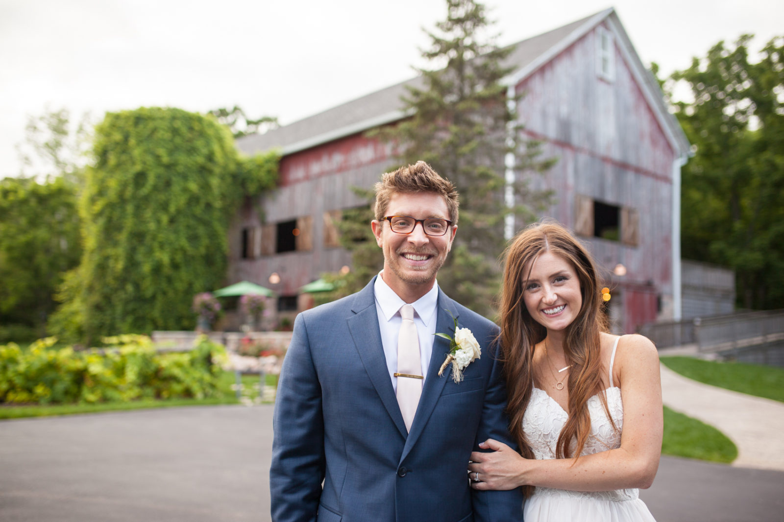 The Farm at Dover Milwaukee Wedding - Brooke & Doug Photography bride and groom dipping in front of barn