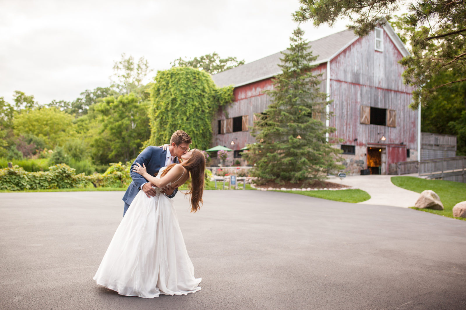 The Farm at Dover Milwaukee Wedding - Brooke & Doug Photography bride and groom dipping in front of barn