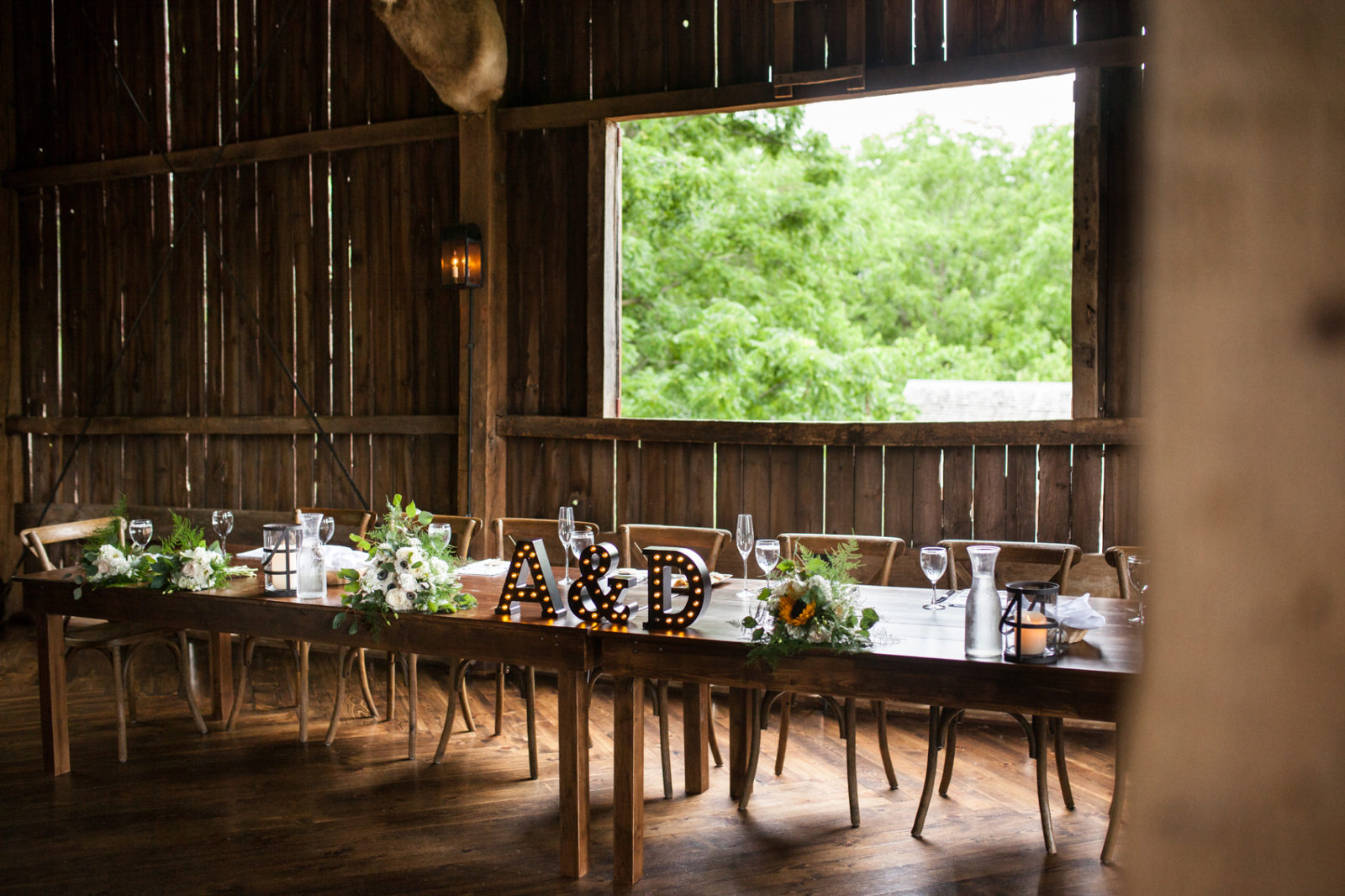 wedding reception in the barn of The Farm at Dover head table with marquee letters