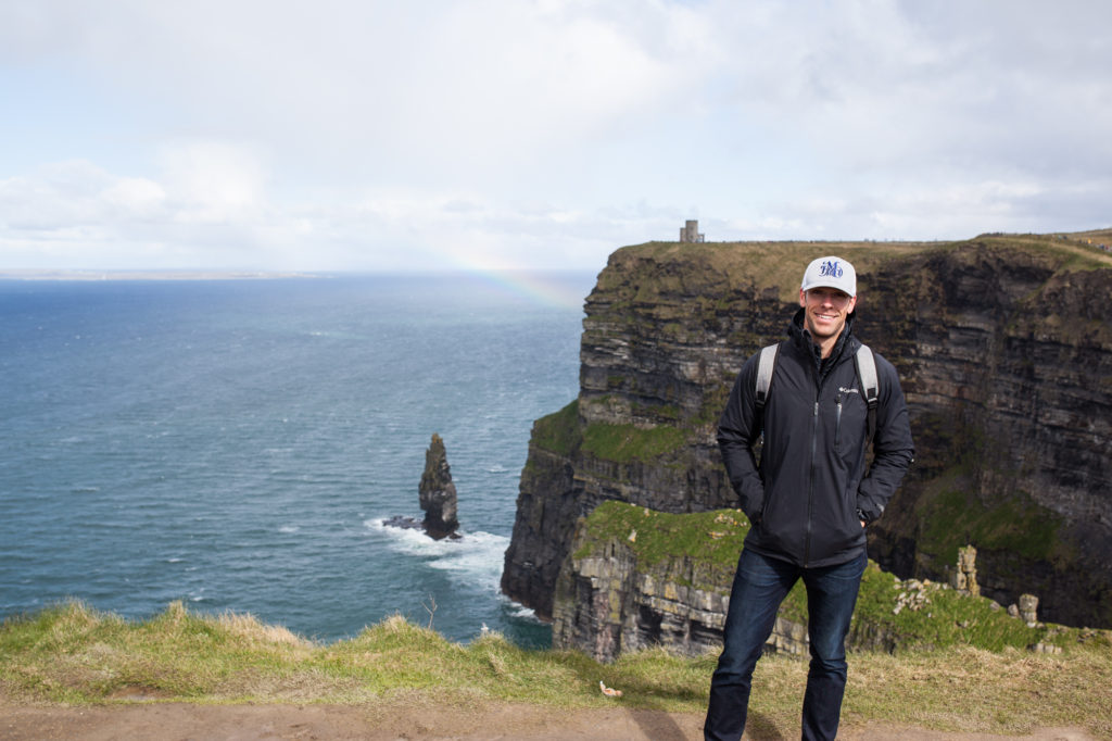 Doug at the cliffs of Moher with rainbow