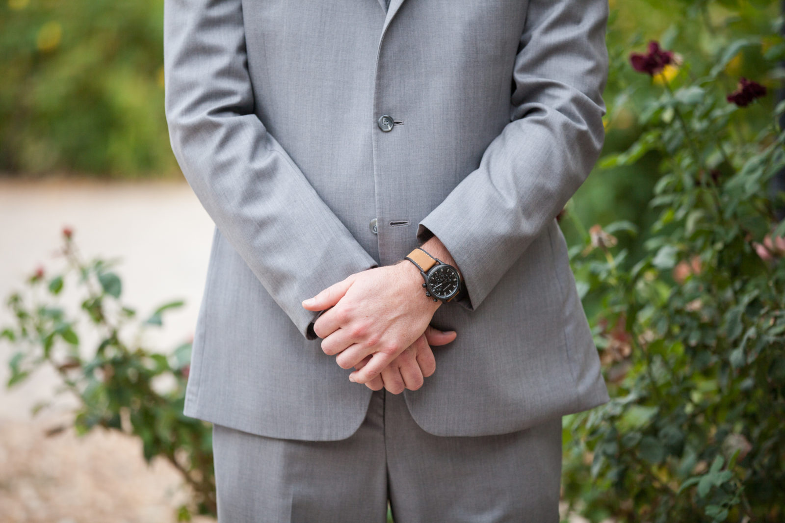 groom wearing grey suits and vests