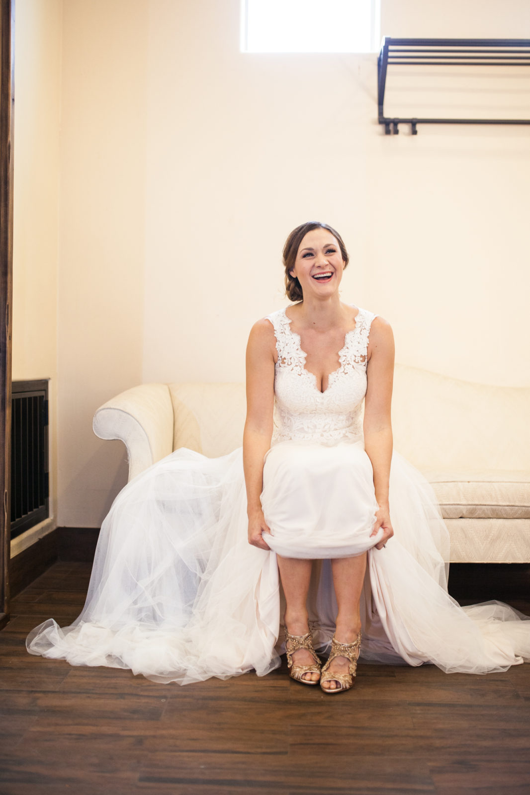 bride wearing Oscar De La Renta Ambria Embroidered Metallic Peep Toe Sandals on her wedding day