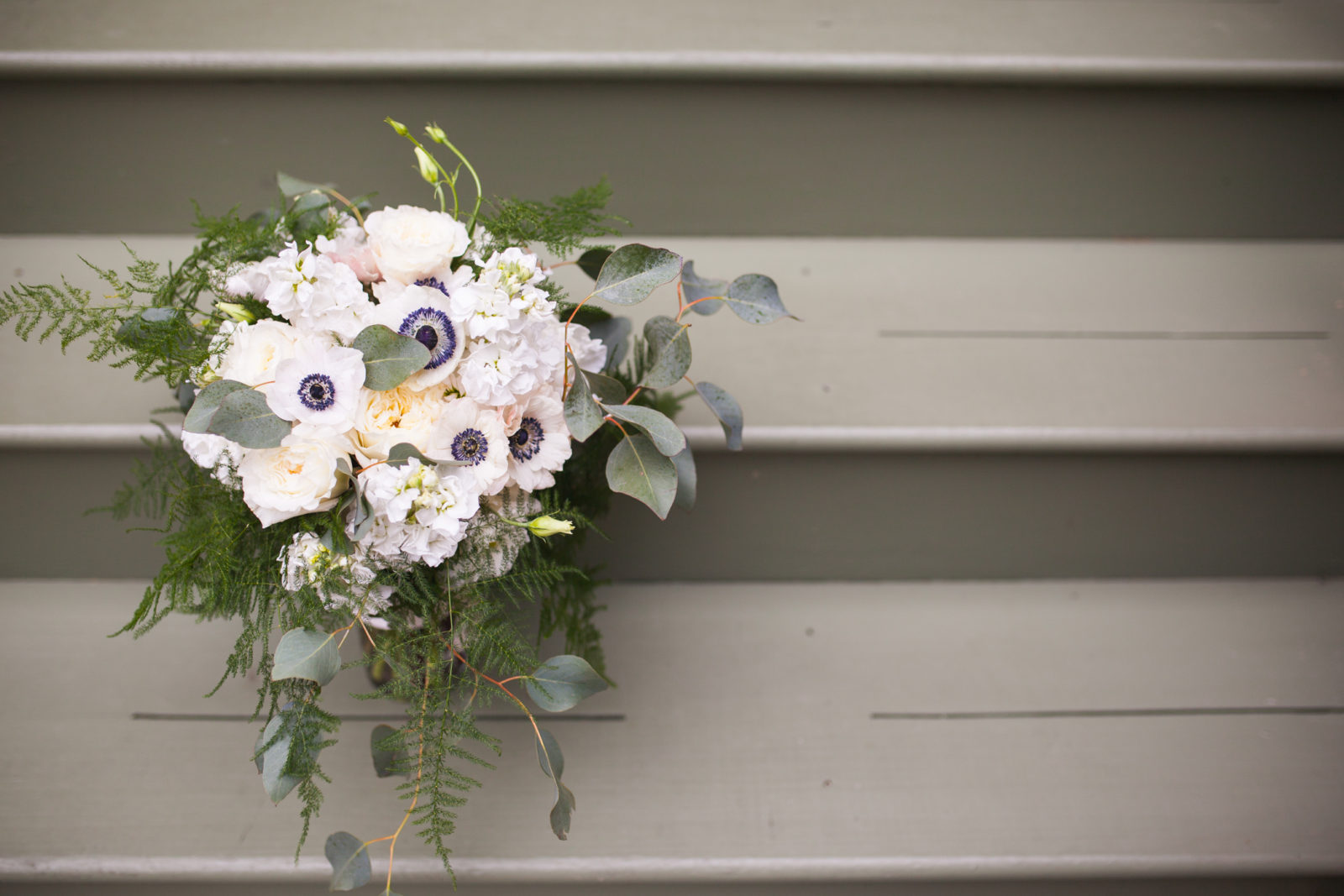 bridal bouquet with black and white anemone and eucalyptus by Gia Bella Flowers 