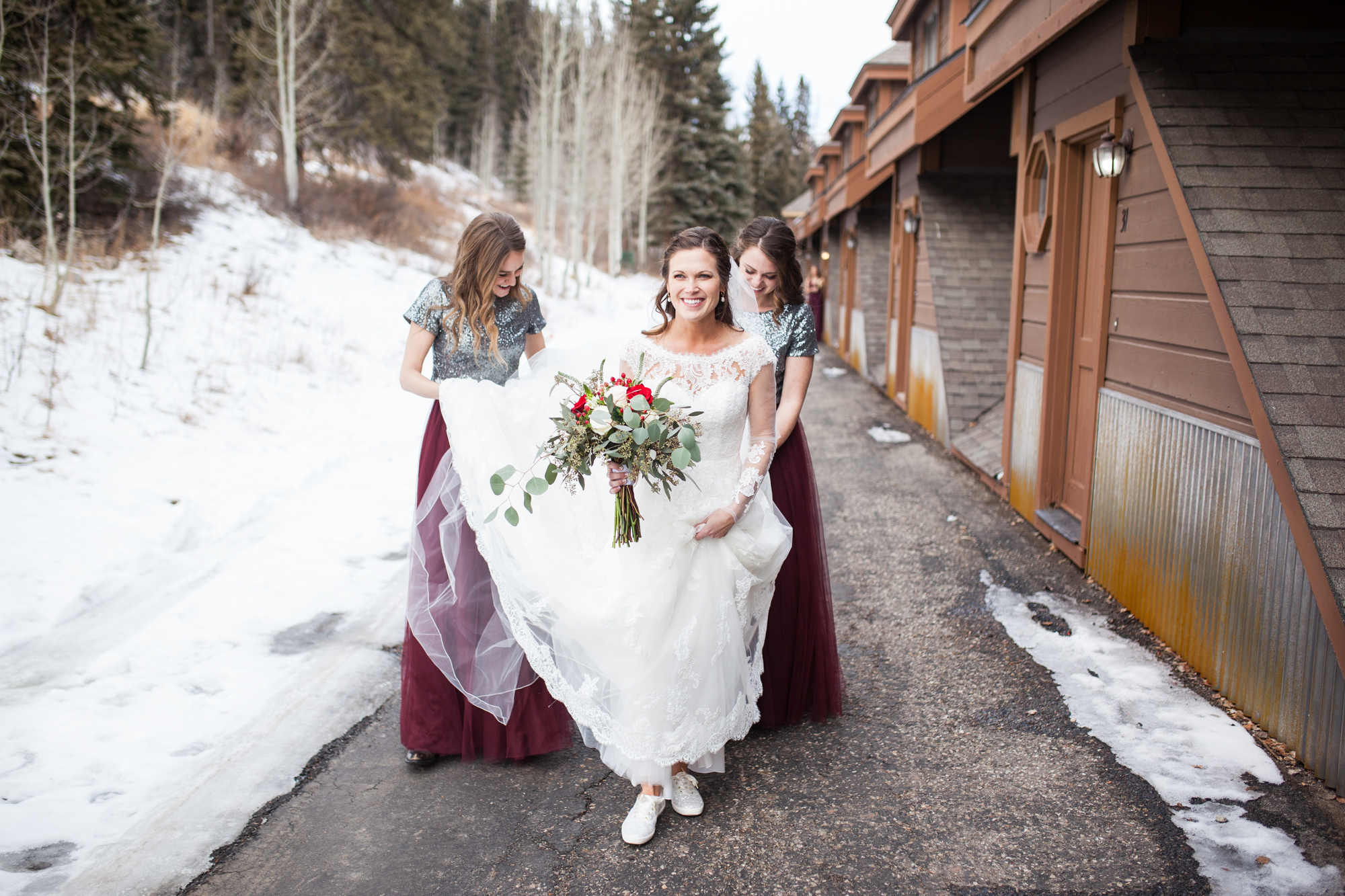 bride walking with bridesmaids, durango colorado winter wedding ideas