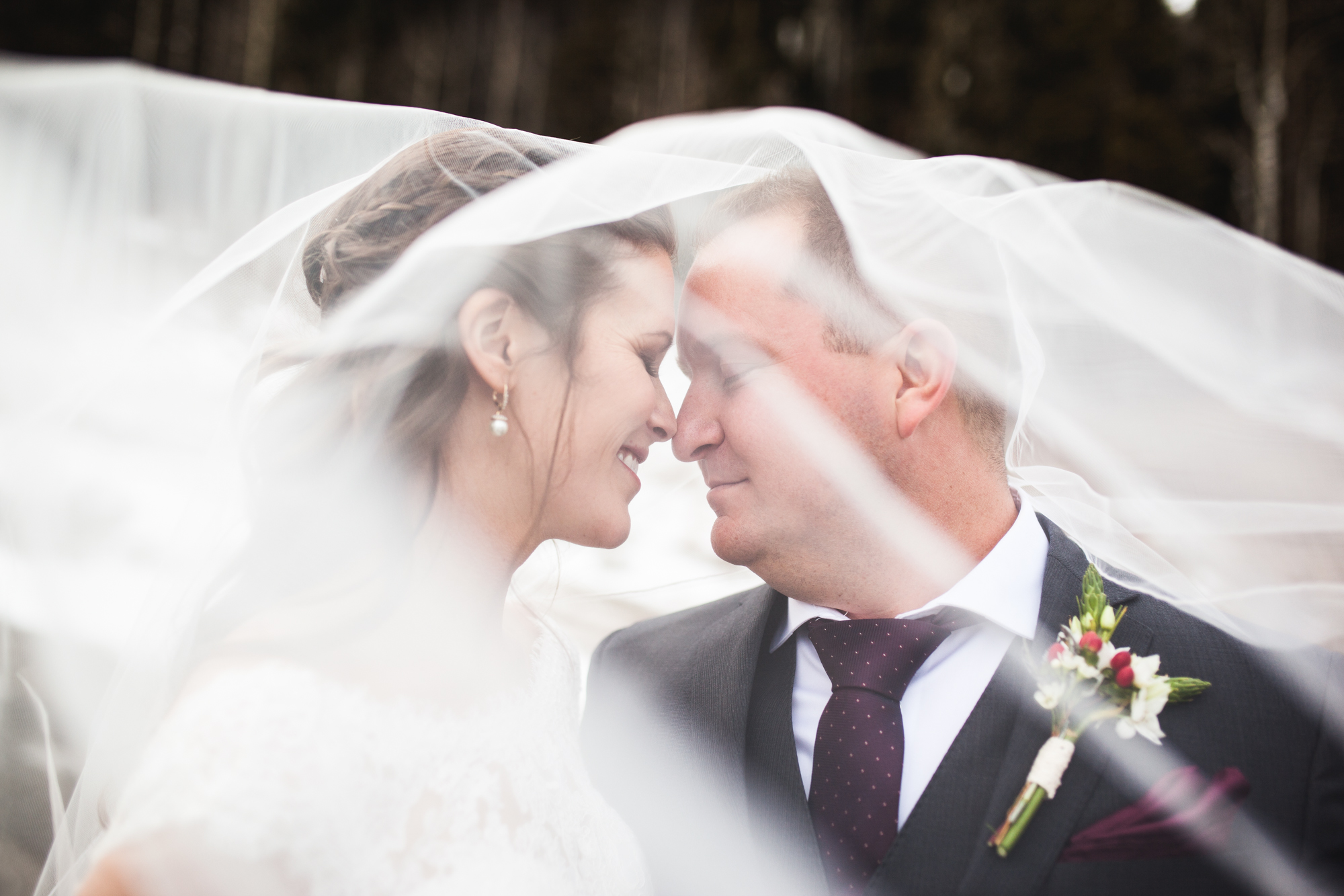 Durango, Colorado Winter Wedding bride and groom under veil