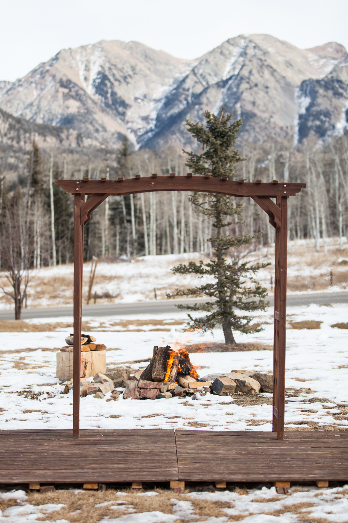 Durango, Colorado Winter outdoor wedding ideas with fire pit and snowy mountains as backdrop