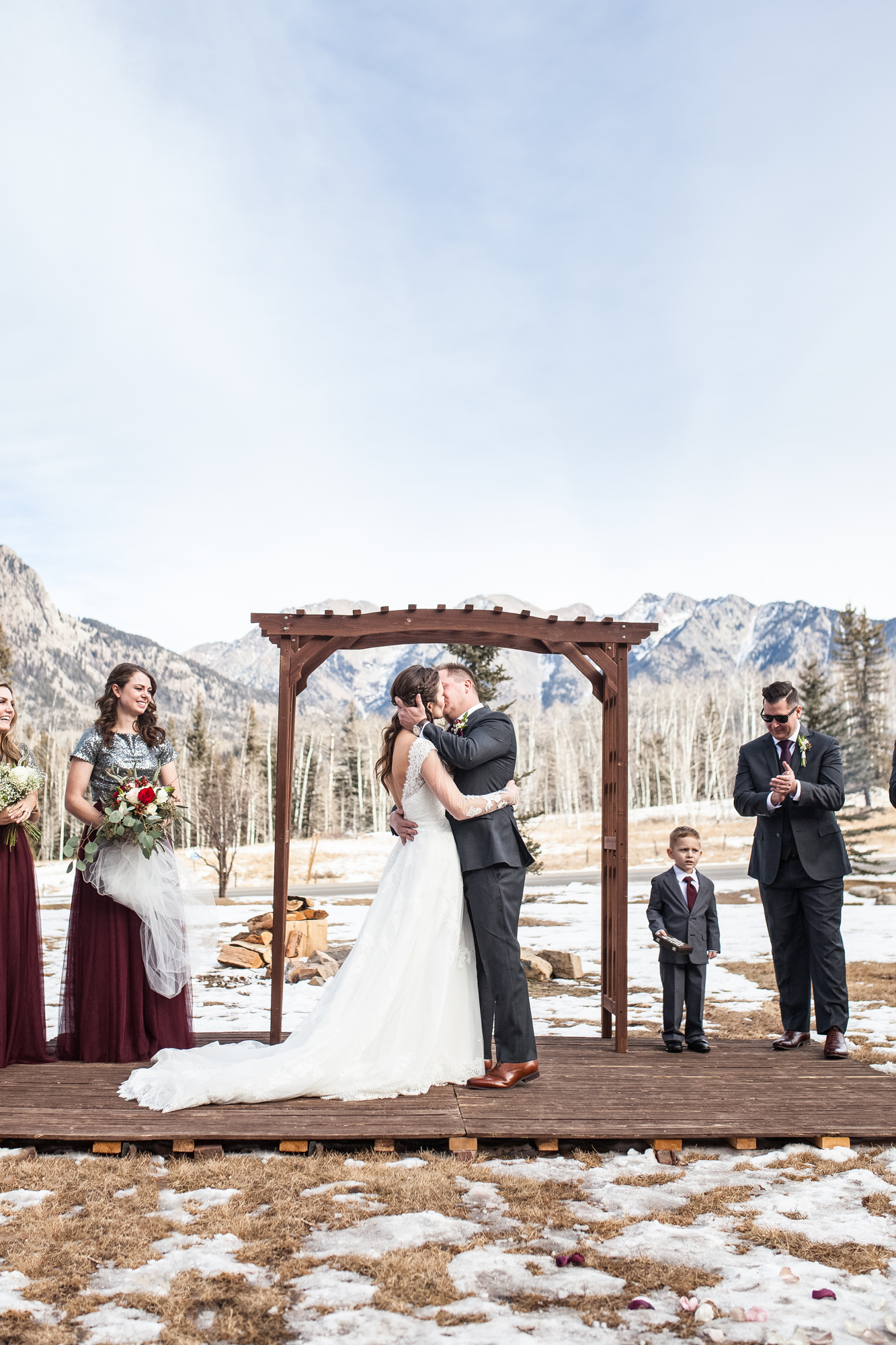 Durango, Colorado Winter Wedding ceremony first kiss as husband and wife, winter bride and groom