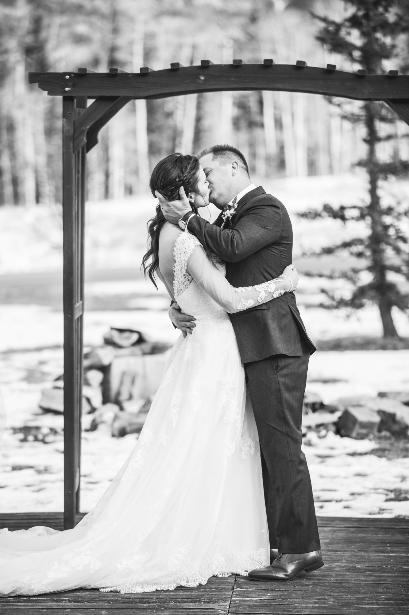 Durango, Colorado Winter Wedding ceremony first kiss as husband and wife, winter bride and groom