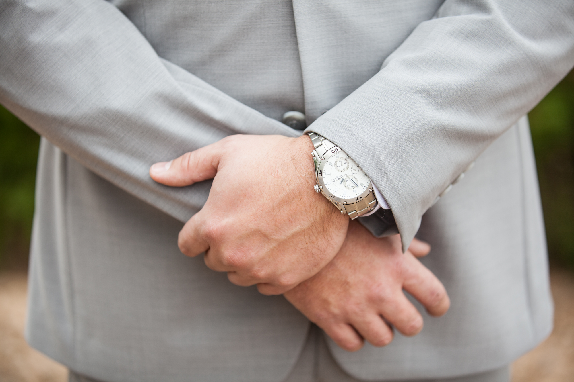 grooms gray suit with watch