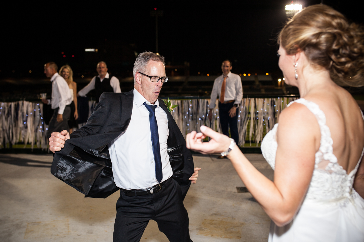 groom dancing at wedding reception