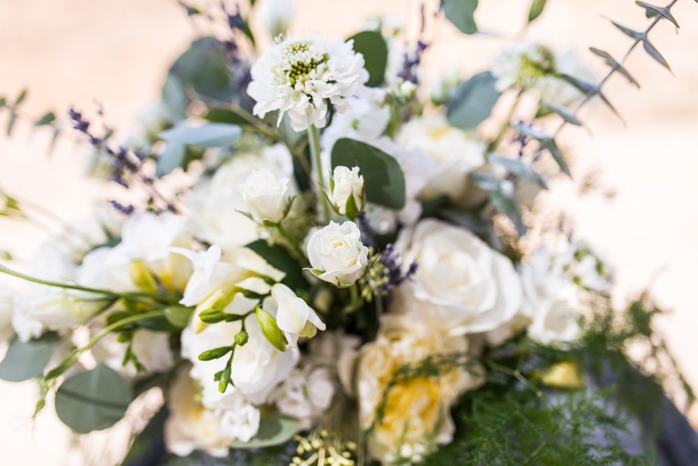 large bridal bouquet with greenery and white flowers