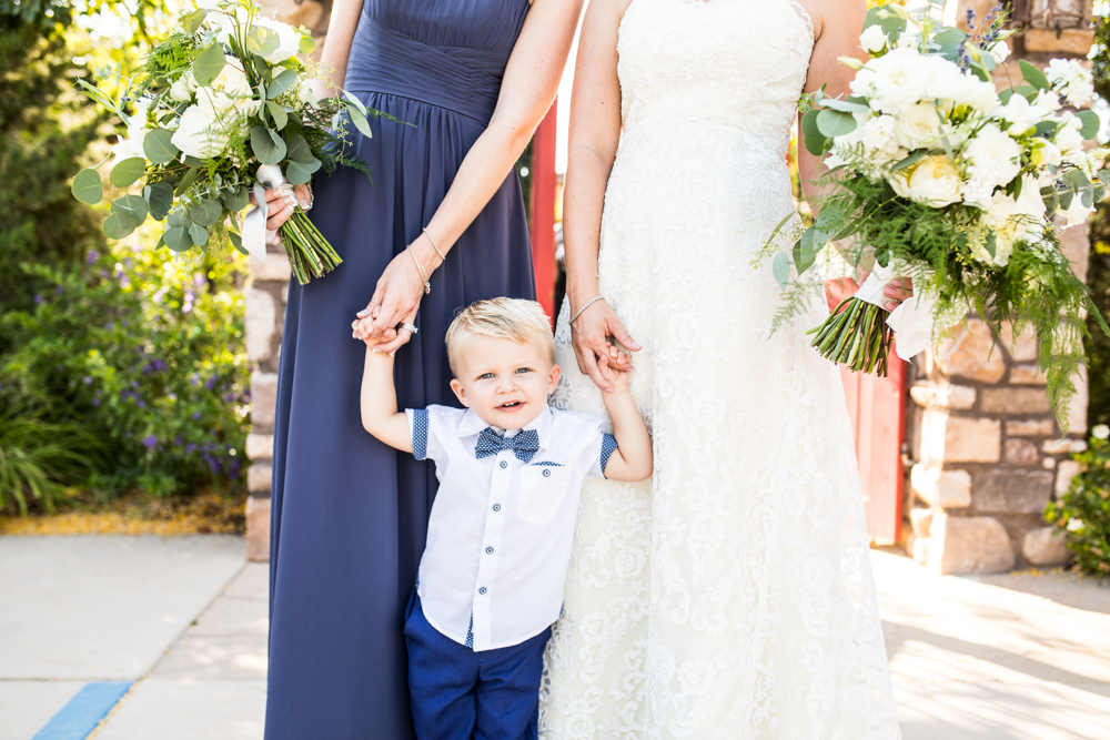 bride and bridesmaid with little ring bearer boy