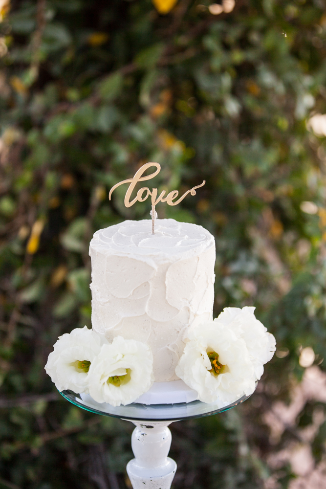 Temecula Winery Wedding cake table and wedding cake with love cake topper