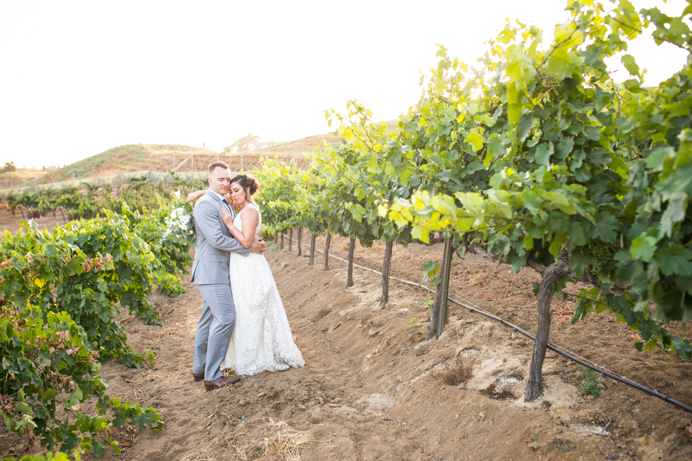 Temecula Winery Wedding bride and groom in vineyard