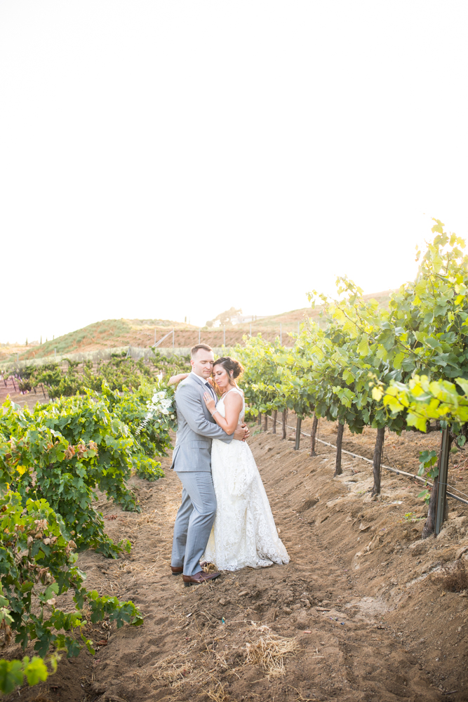 Temecula Winery Wedding bride and groom in Europa Village vineyard