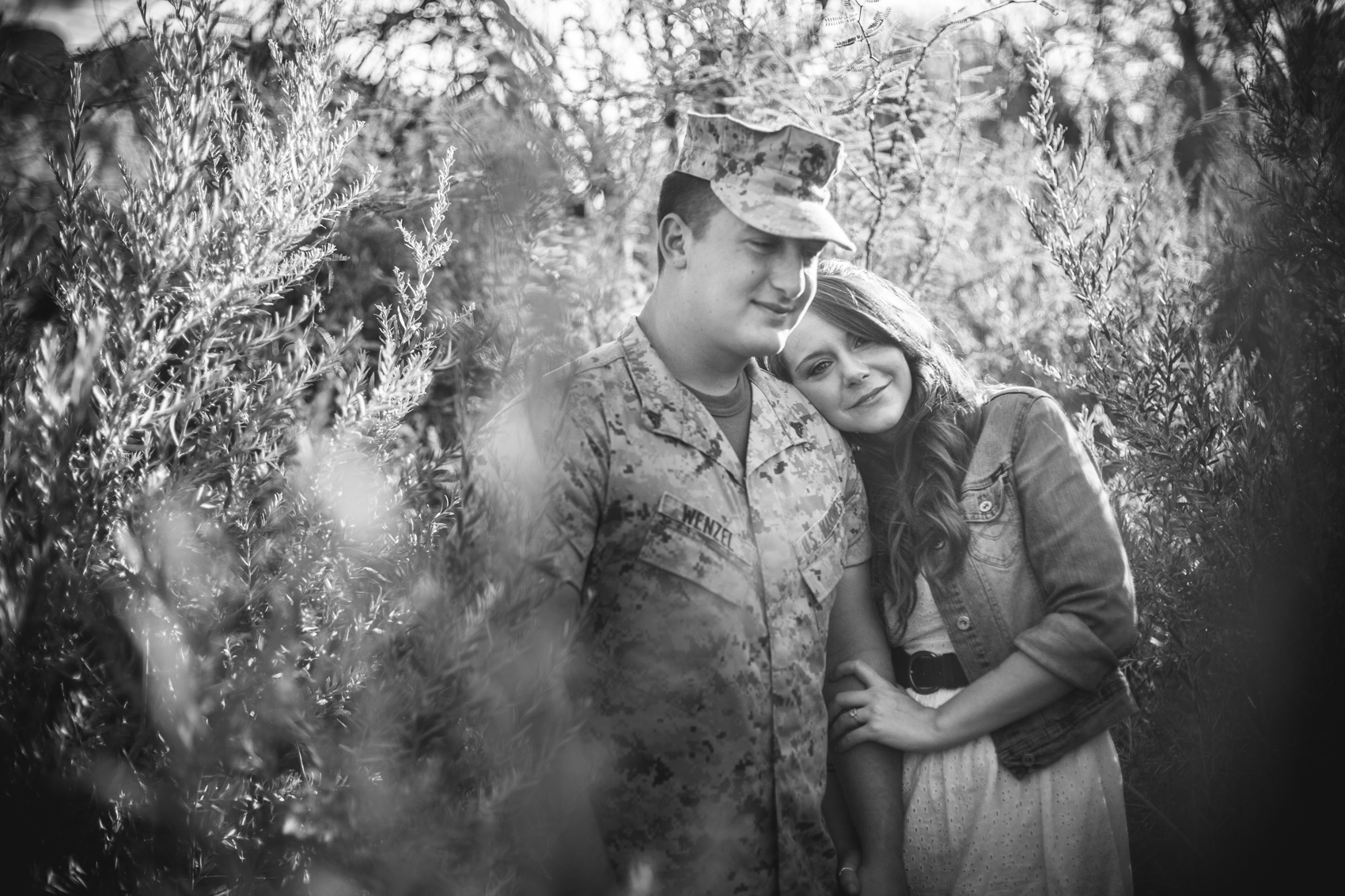 Military couple in desert foliage