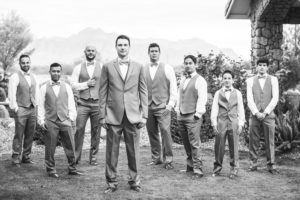 groom and groomsmen wearing grey suits and vests