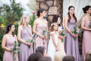bridesmaids and flower girl during wedding ceremony