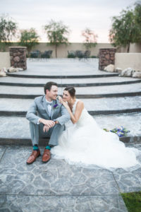 bride and groom sitting on steps