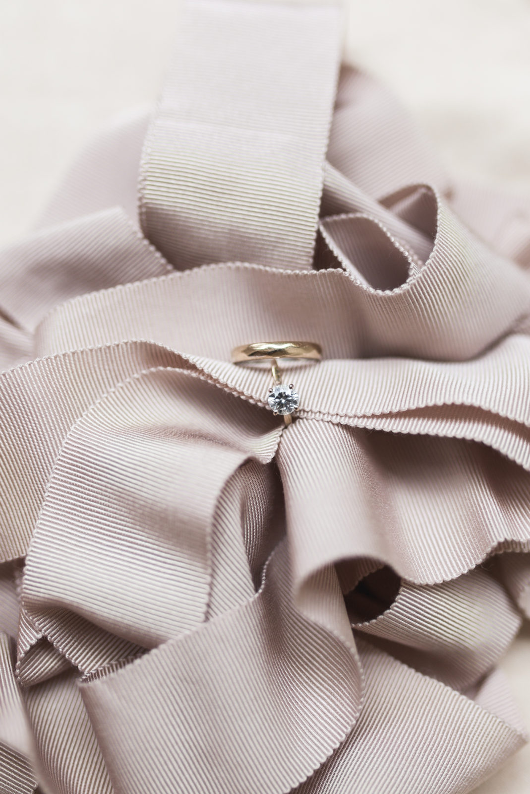 Shane Co. diamond engagement ring and wedding band in ribbons
